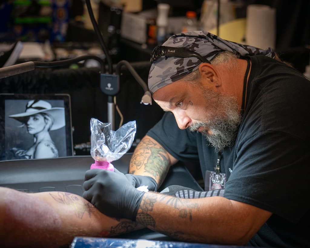 Tattoo artist at work — Indy Tattoo Expo coverage by Hexaxia Media
